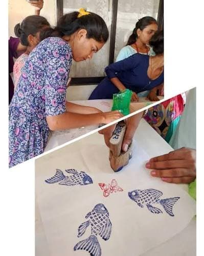 Design students block-printing fish motifs on fabric