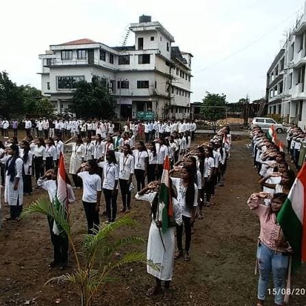 Students assembled on the campus ground with the national flag on Independence Day