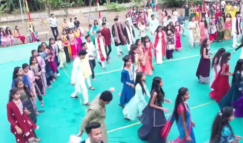Students dancing together at a college festival
