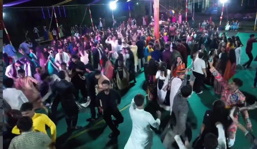 Students dancing at a college festival at night