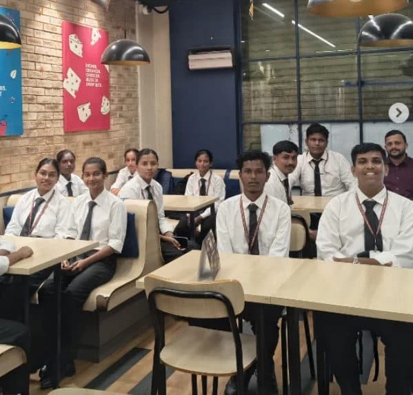 Students seated in the Domino’s restaurant during the industrial visit