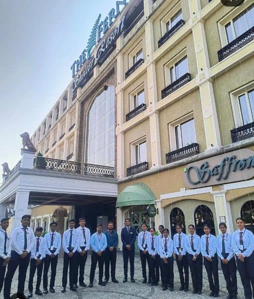 Hospitality students in front of The Fern Shelter Resort, Palghar, on an industrial visit