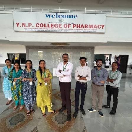Staff of Y.N.P. College of Pharmacy at the college entrance