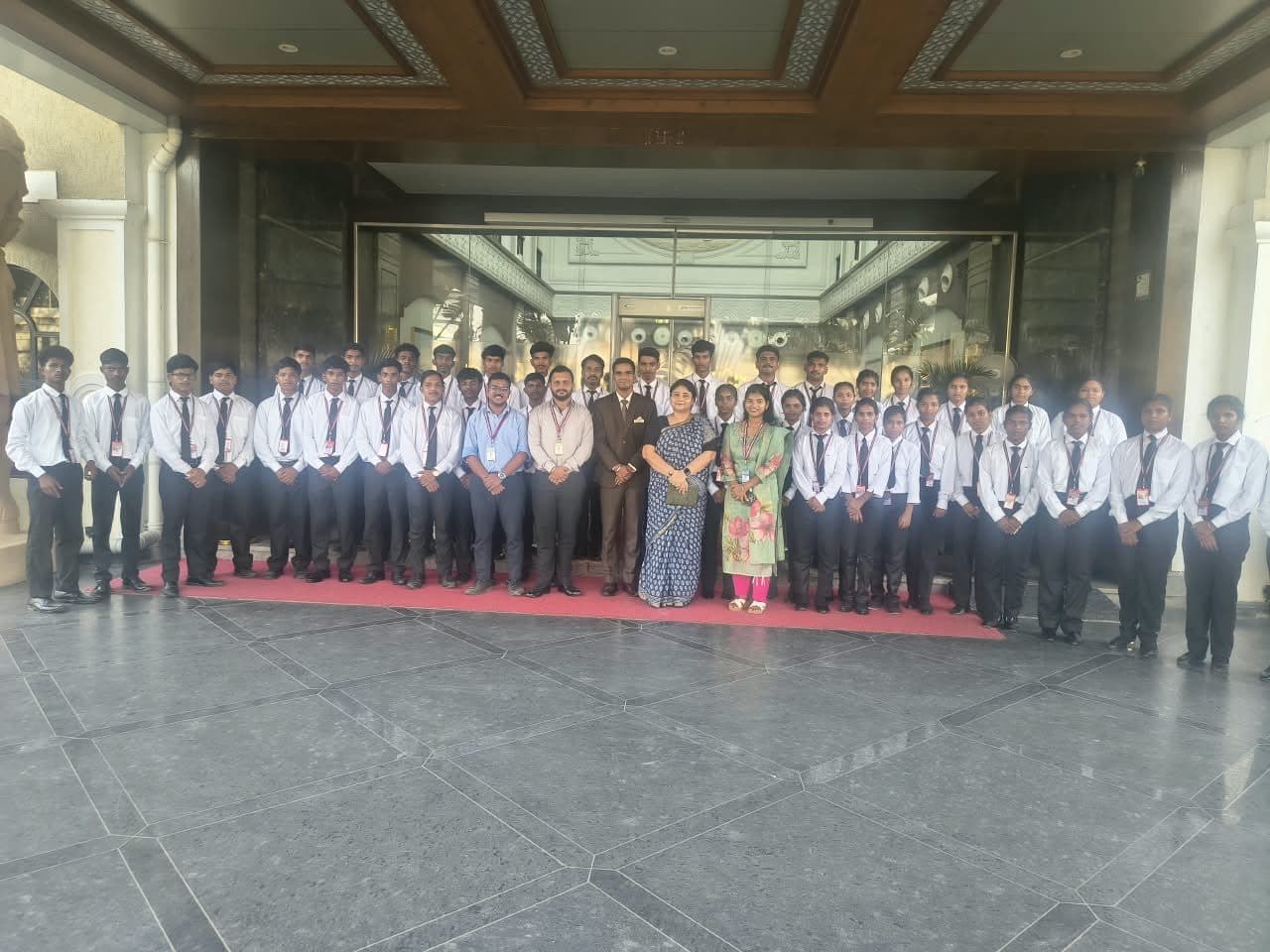 Students and staff in the lobby during the industrial visit to The Fern Shelter Resort, Palghar